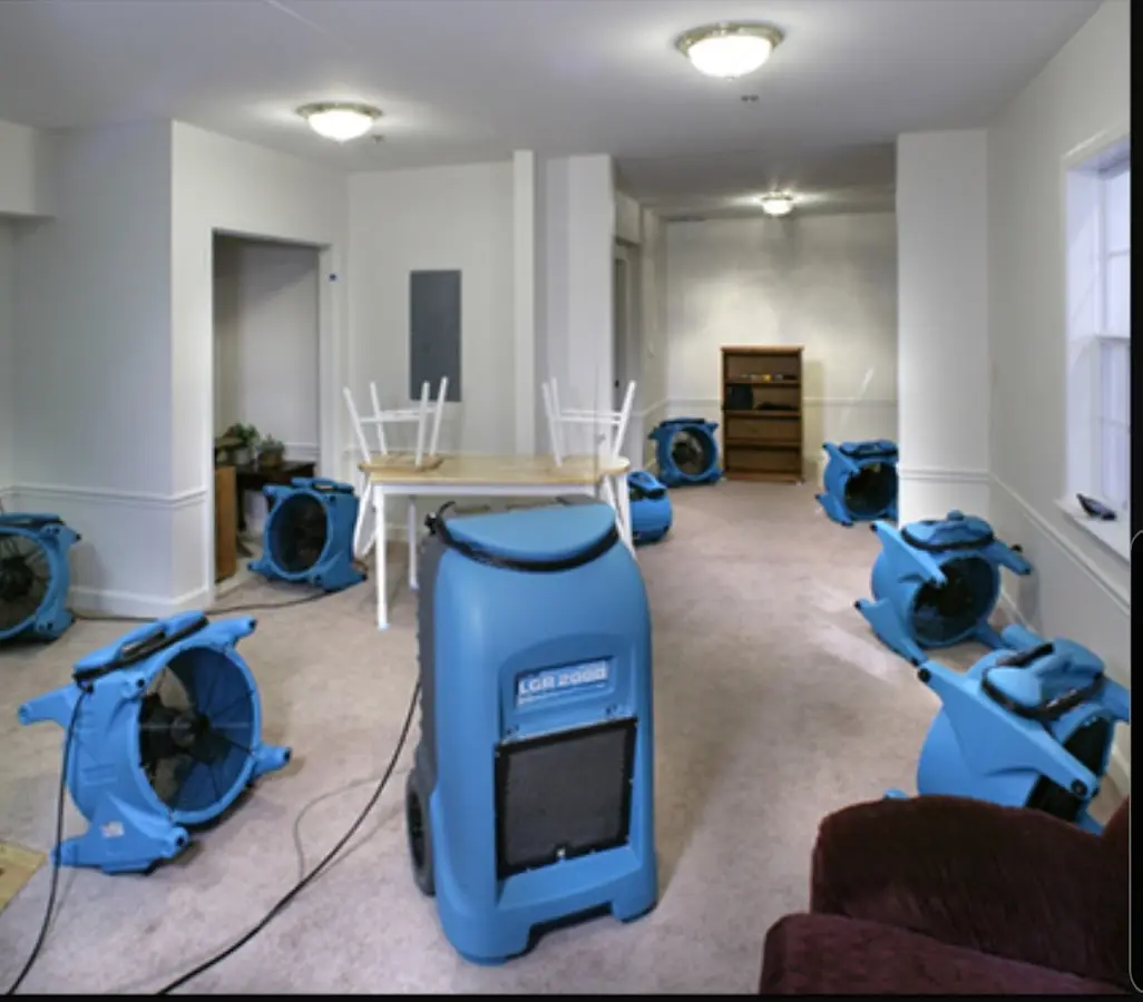 Air movers and dehumidifier setup for Water Damage Restoration in St. Clair